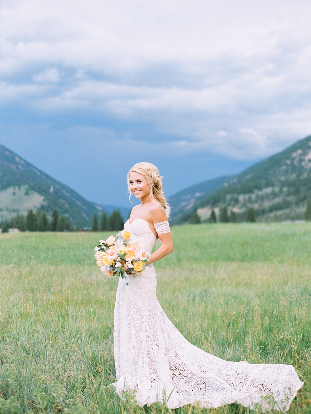320 Ranch Wedding Bride in front of mountain backdrop photographed by Orange Photographie