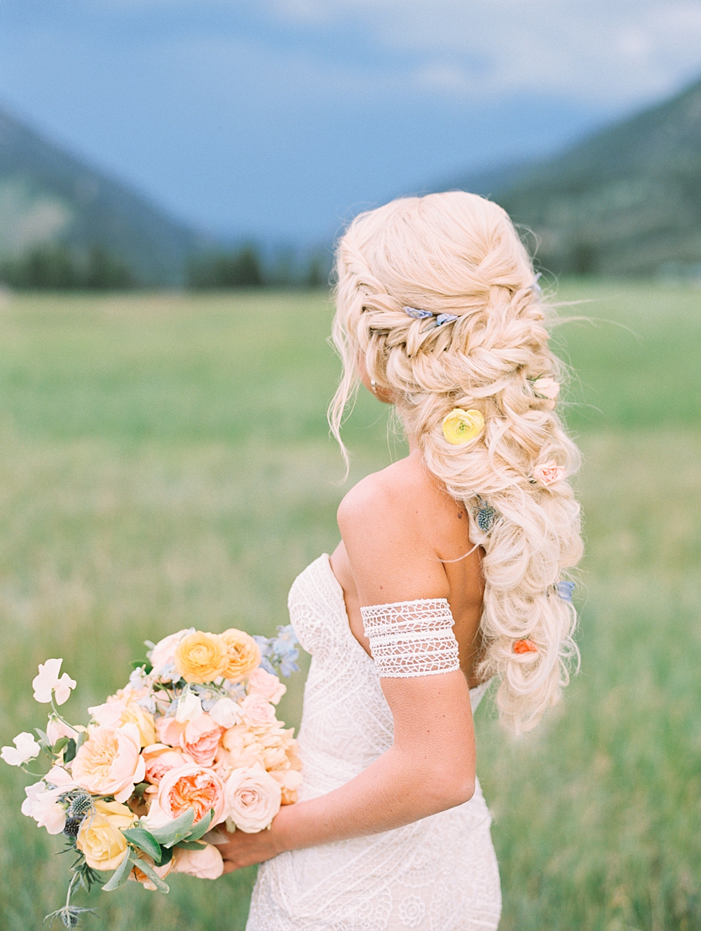 320 Ranch Wedding Bride in front of mountain backdrop photographed by Orange Photographie
